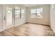 Dining area with ample natural light featuring luxury vinyl plank flooring and access to the patio at 2811 Morning Song Way, Lancaster, SC 29720