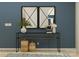 Staged entryway with a console table, decorative mirrors, baskets, vases, and a rug at 2811 Morning Song Way, Lancaster, SC 29720
