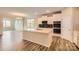 Modern kitchen with stainless steel appliances, white cabinetry, and an island with quartz countertops at 2811 Morning Song Way, Lancaster, SC 29720