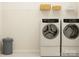 Functional laundry room featuring modern washer and dryer units and ample storage space at 2811 Morning Song Way, Lancaster, SC 29720