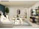 Bright living room showcasing contemporary furniture, a decorative mirror, and stylish shelving at 2811 Morning Song Way, Lancaster, SC 29720