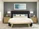 A calming main bedroom featuring a luxurious bed, elegant nightstands, and decorative wall art at 2811 Morning Song Way, Lancaster, SC 29720
