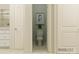 Bathroom features a toilet, tiled floor, gray accent wall with art, and a view of the vanity at 2814 Morning Song Way, Lancaster, SC 29720