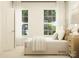 Bedroom features a bed with neutral bedding, two windows with sheer curtains, and a nightstand at 2814 Morning Song Way, Lancaster, SC 29720