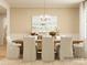 Inviting dining room featuring a wooden table with upholstered chairs, a chandelier and decorative wall art at 2814 Morning Song Way, Lancaster, SC 29720