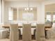 Beautiful dining room with a wooden table, upholstered chairs, a chandelier and decorative wall panels at 2814 Morning Song Way, Lancaster, SC 29720