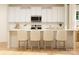 Charming kitchen with white cabinets, an island with seating, and stainless steel appliances against white subway tile backsplash at 2814 Morning Song Way, Lancaster, SC 29720