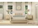 Inviting main bedroom with a large bed, neutral toned walls, and a bench seat at 2814 Morning Song Way, Lancaster, SC 29720