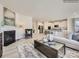 Bright living room featuring a fireplace, modern decor, and an open layout connecting to the kitchen at 2817 Morning Song Way, Lancaster, SC 29720
