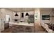 Bright, modern kitchen with white cabinets, stainless steel appliances, and an eat-in island at 2910A Williams Rd, Matthews, NC 28105