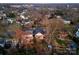 An aerial view shows a charming neighborhood with tree-lined streets and well-maintained homes at 2924 Chelsea Dr, Charlotte, NC 28209