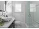 Bathroom featuring a glass walk-in shower and marble vanity at 2924 Chelsea Dr, Charlotte, NC 28209