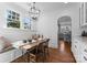 Cozy breakfast nook featuring natural lighting, stylish seating, and seamless transition to the kitchen at 2924 Chelsea Dr, Charlotte, NC 28209