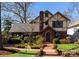 Stately two-story brick home with well-maintained landscaping and a brick walkway at 2924 Chelsea Dr, Charlotte, NC 28209