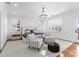 Bright main bedroom with shuttered windows, chandelier, and a neutral color palette at 2924 Chelsea Dr, Charlotte, NC 28209