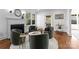 Sun-filled sitting room featuring stylish chairs, a fireplace, and a view of the outdoor space at 2924 Chelsea Dr, Charlotte, NC 28209