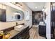 Modern bathroom with dual vanities, an updated shower, and natural light from the window at 308 Dakota St, Kannapolis, NC 28083