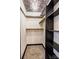 A closet with shelving, a decorated ceiling, and carpeted floors offers plenty of storage space at 308 Dakota St, Kannapolis, NC 28083
