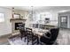 Open floor plan shows the dining room that features a decorative fireplace and an industrial-style light fixture at 308 Dakota St, Kannapolis, NC 28083
