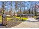 Charming exterior view of a brick ranch home with a long driveway and lush lawn at 308 Dakota St, Kannapolis, NC 28083