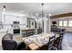 Bright, open kitchen features stainless steel appliances, a dining room, and barstool seating at the kitchen island at 308 Dakota St, Kannapolis, NC 28083