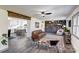 An open-concept living room with a view of the kitchen and an accent wall with shelving at 308 Dakota St, Kannapolis, NC 28083