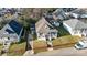 An aerial view shows the compact property, adjacent houses, and small storage shed at 314 S Bruns Ave, Charlotte, NC 28208