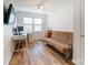 Cozy bedroom with natural light from window, complemented by a ceiling fan and hardwood flooring at 314 S Bruns Ave, Charlotte, NC 28208