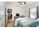 This bedroom has a cozy carpet, is well lit, and has a ceiling fan at 314 S Bruns Ave, Charlotte, NC 28208