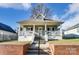 Charming home with a covered front porch and brick landscaping at 314 S Bruns Ave, Charlotte, NC 28208