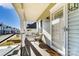 Cozy front porch seating area perfect for relaxing on a sunny day, with glass front door at 314 S Bruns Ave, Charlotte, NC 28208