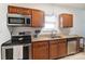 Well-equipped kitchen featuring stainless steel appliances and granite countertops at 314 S Bruns Ave, Charlotte, NC 28208