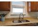 The kitchen features a stainless steel sink and faucet with a granite countertop at 314 S Bruns Ave, Charlotte, NC 28208