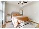 Bright main bedroom features lots of natural light, cozy bedding, and a modern ceiling fan at 314 S Bruns Ave, Charlotte, NC 28208