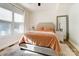 This bright main bedroom features lots of natural light, cozy bedding, and a modern ceiling fan at 314 S Bruns Ave, Charlotte, NC 28208