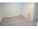 Cozy bedroom with neutral carpet and a walk-in closet, providing a comfortable and organized living space at 3207 Lisburn St, Charlotte, NC 28227