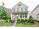 Charming two-story brick home featuring a well-manicured lawn and inviting front porch at 3207 Lisburn St, Charlotte, NC 28227