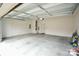Spacious two-car garage with concrete floors, ample lighting, and high ceilings offering versatile storage and parking at 3207 Lisburn St, Charlotte, NC 28227