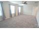 Spacious bedroom featuring carpet, neutral colors, and lots of natural light at 3207 Lisburn St, Charlotte, NC 28227
