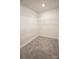 A walk-in closet featuring carpeted flooring and white wire shelving offering ample storage space at 3207 Lisburn St, Charlotte, NC 28227
