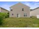 View of the house from the backyard showcasing the siding and sliding glass door at 3627 Alexander Forest Dr, Charlotte, NC 28269