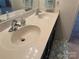 Bathroom featuring a double vanity with laminate counters and white sinks at 3627 Alexander Forest Dr, Charlotte, NC 28269