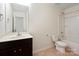 Well-lit bathroom featuring a vanity with dark cabinets and a shower and tub combination at 3627 Alexander Forest Dr, Charlotte, NC 28269