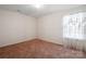 Cozy bedroom with a plush carpet and a window at 3627 Alexander Forest Dr, Charlotte, NC 28269