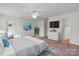 Bright bedroom showcasing neutral tones, a ceiling fan, and ample closet space at 3627 Alexander Forest Dr, Charlotte, NC 28269