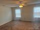 Bedroom with carpet, a ceiling fan, and bright windows at 3627 Alexander Forest Dr, Charlotte, NC 28269