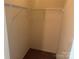 A simple closet space with a rod and shelf at 3627 Alexander Forest Dr, Charlotte, NC 28269