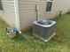 Home exterior showing modern air conditioning unit and well maintained landscape at 3627 Alexander Forest Dr, Charlotte, NC 28269