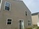 Home exterior showing neutral-colored siding and several windows at 3627 Alexander Forest Dr, Charlotte, NC 28269