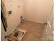 A spacious laundry area with hookups and ample room for storage at 3627 Alexander Forest Dr, Charlotte, NC 28269